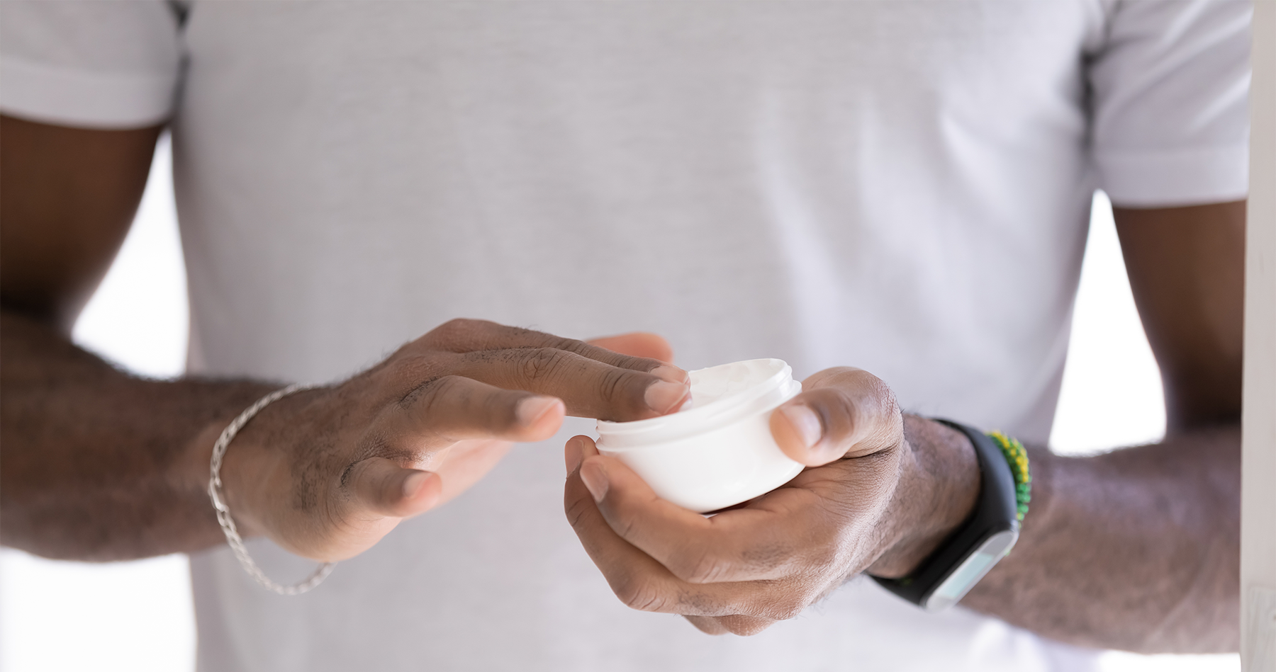 man using body butter